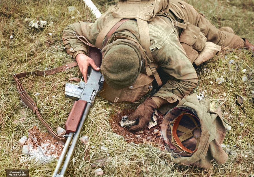 An Unidentified American Soldier, Shot Dead By A German Sniper, Clutches His Rifle And Hand Grenade
