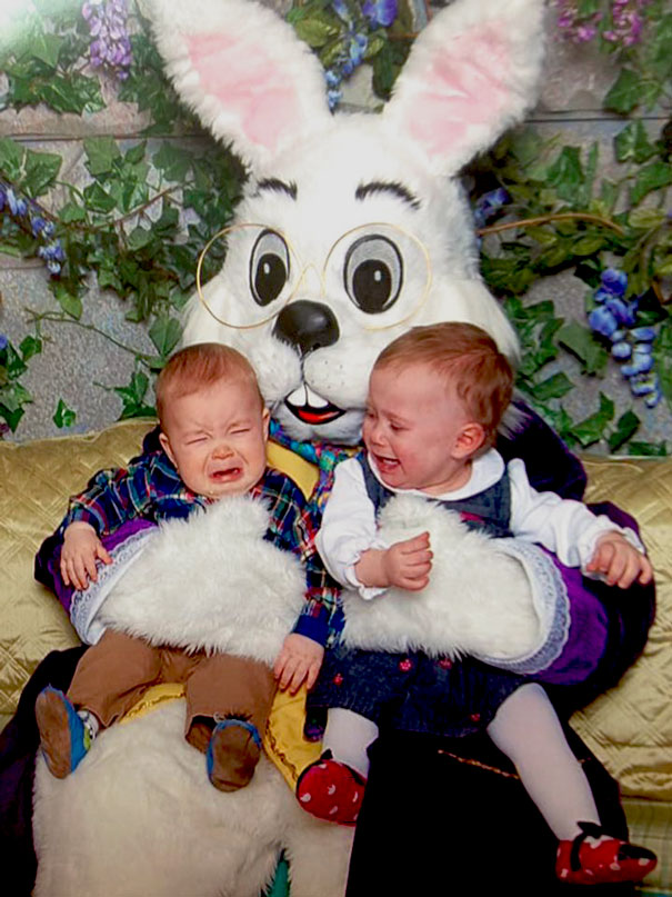 Crying toddlers with a vintage Easter bunny in a comedic, unsettling setting.