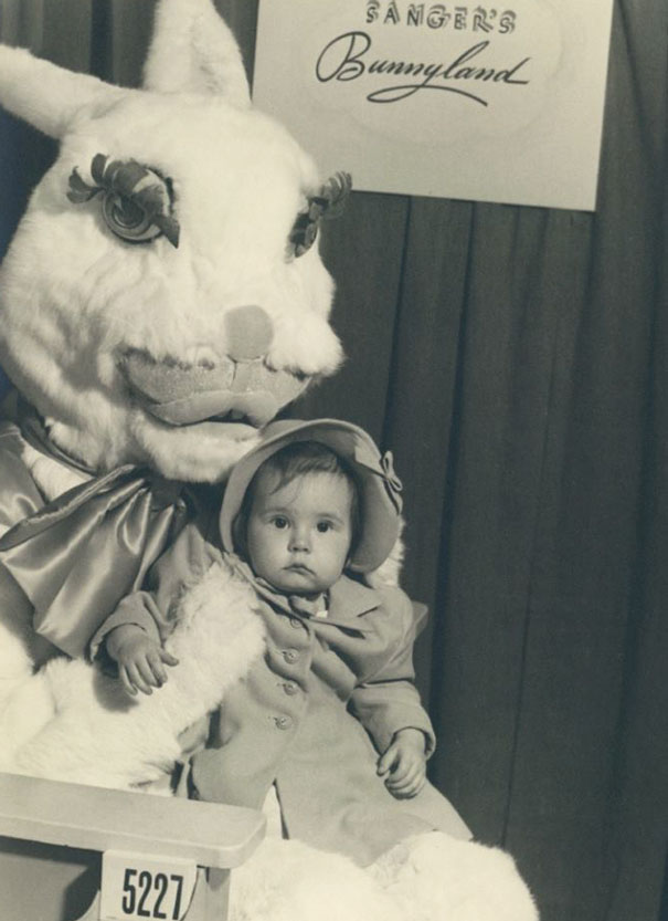 Vintage Easter Bunny with a child in Sanger's Bunnyland, evoking an eerie atmosphere.