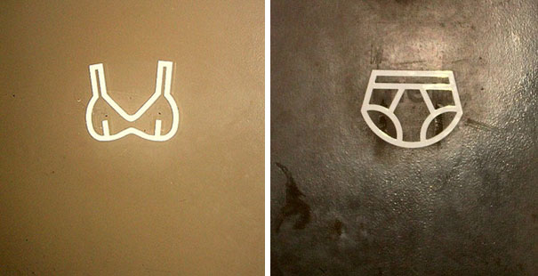Funny bathroom signs with bra and underwear symbols.