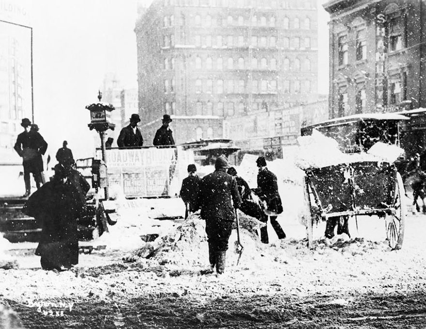 Workers Remove Snow In Times Square