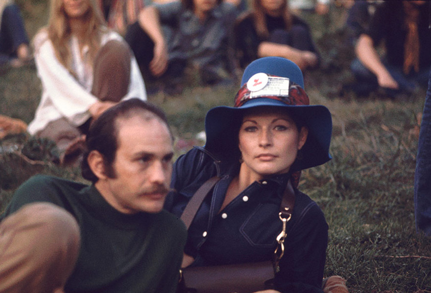 A Man And Woman Lie On The Grass During A Performance On The 'Free Stage' At Woodstock