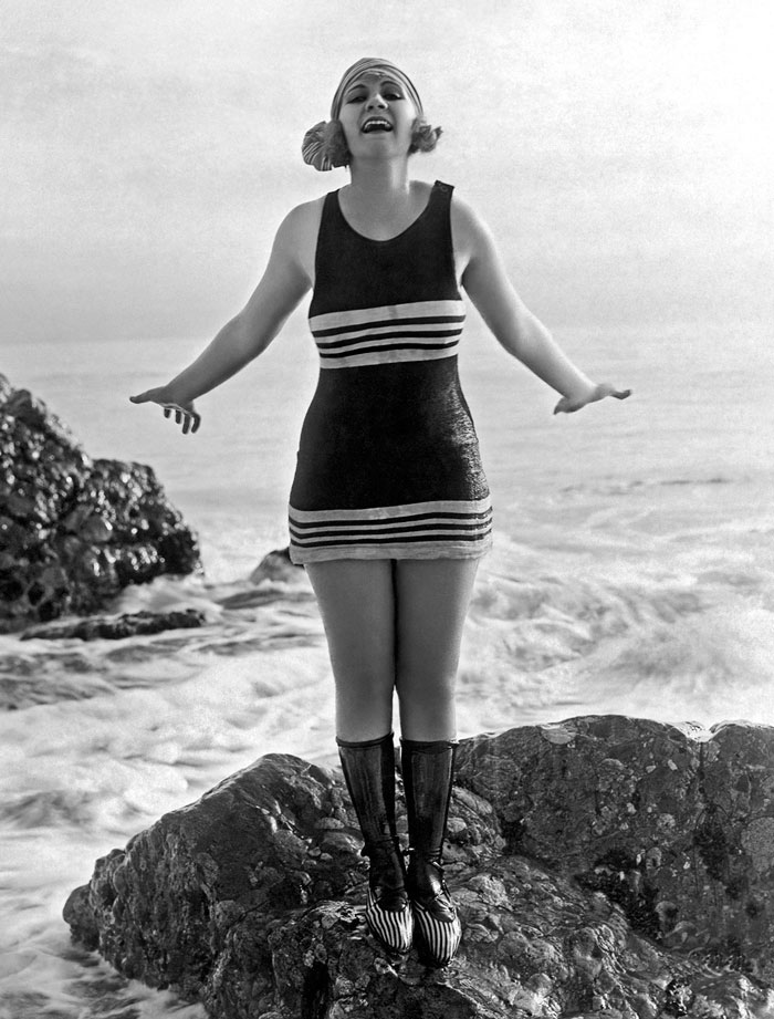 A Flapper In Her Bathing Suit On A Rock At The Beach, Los Angeles, 1922