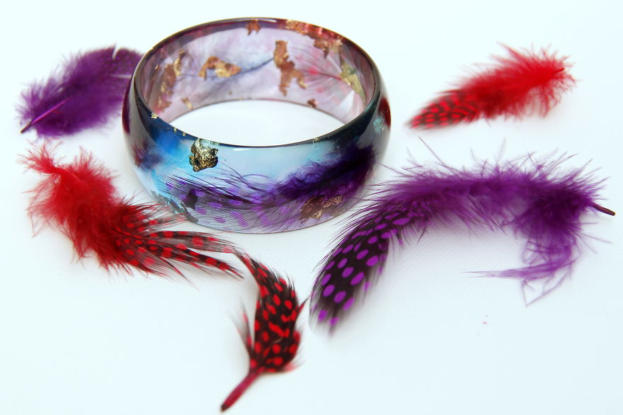 Handmade Jewelry From A Resin And Feathers.