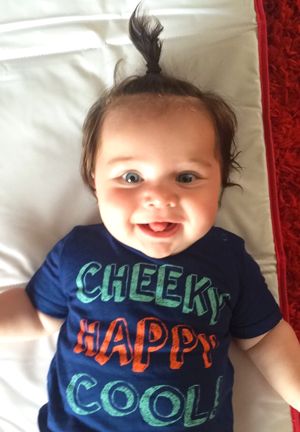 Happy, Little Boy With Cute Palm-tree Hairstyle