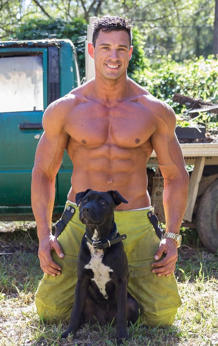Image result for hot shirtless guys holding puppies.