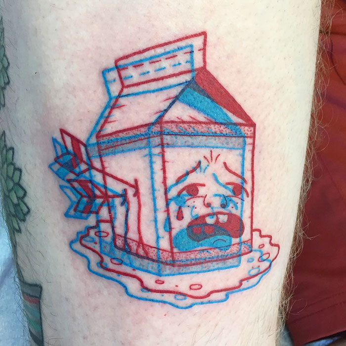 3D-inspired tattoo of a crying milk carton in red and blue lines on skin.