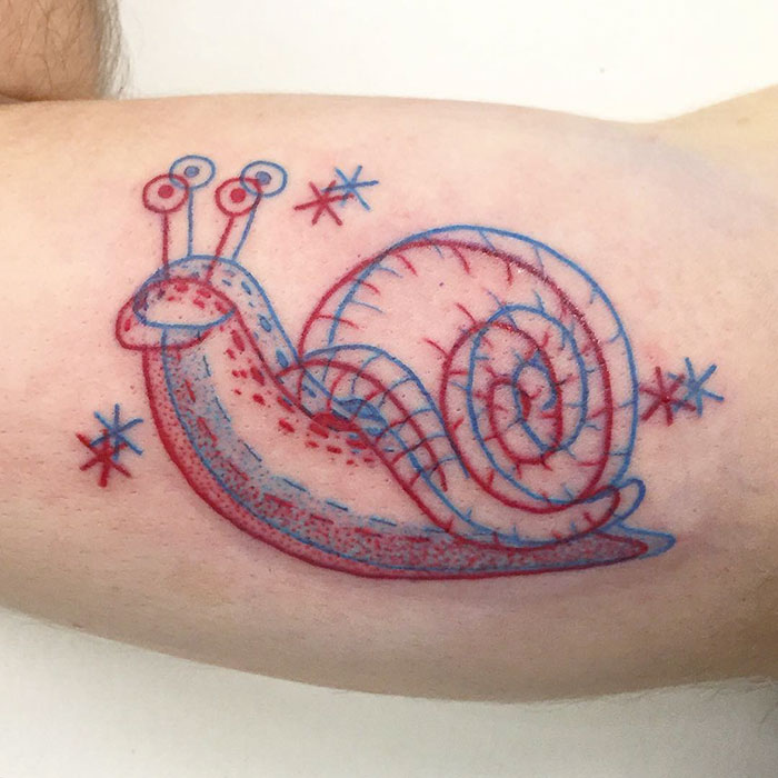 3D-inspired tattoo of a colorful snail with stars on skin.