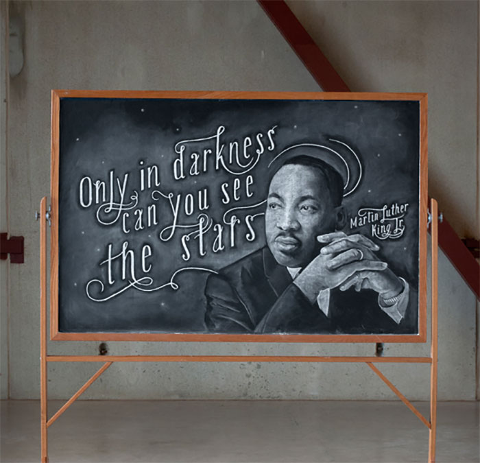 Chalkboard art with quote, showcasing beautiful handwriting alongside a portrait of a man.