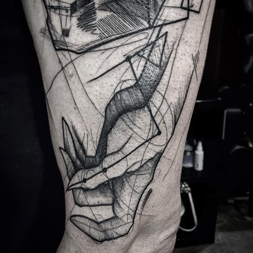 Sketch tattoo by Frank Carrilho on a forearm, showing artistic lines and abstract design elements.