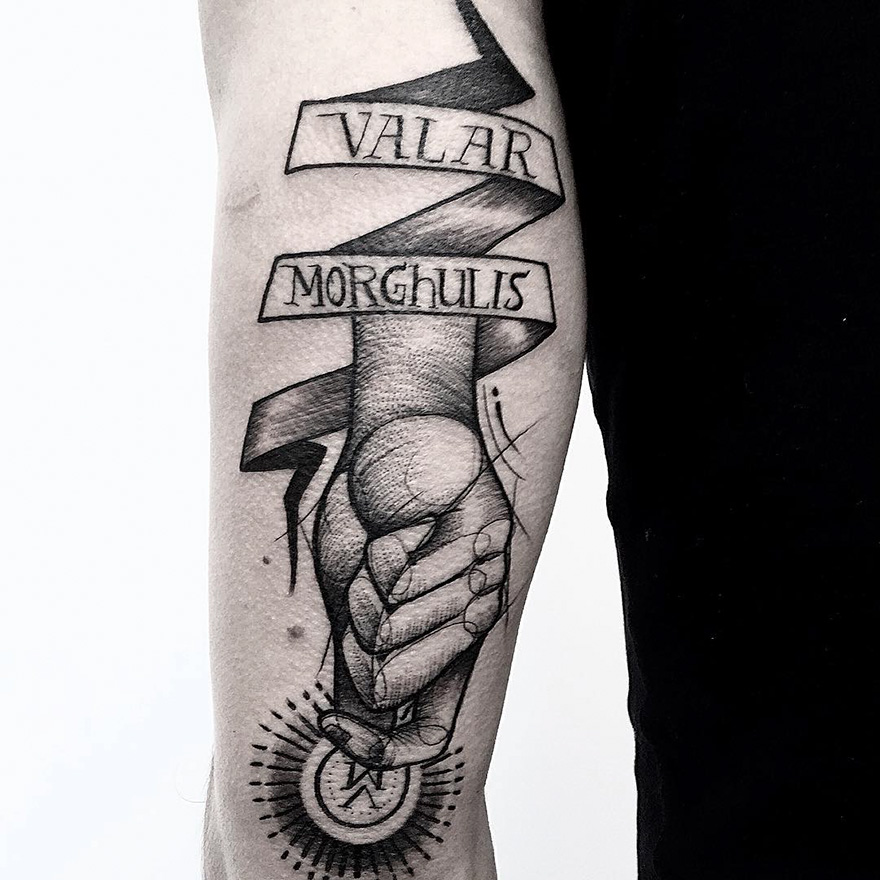 Sketch tattoo by Frank Carrilho depicting hands and a ribbon with text, showcasing artistic imperfection.