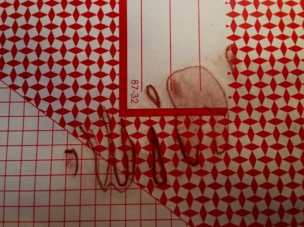 Spilt Chocolate Milk On My Stacked Notepads - One Of Them Dried Like This