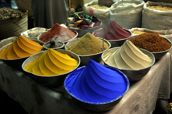 Colorful spices perfectly arranged in bowls, satisfying every perfectionist’s soul.