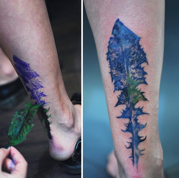 Botanical tattoo on a leg created using a real leaf stencil, showcasing intricate plant detail in dark ink.