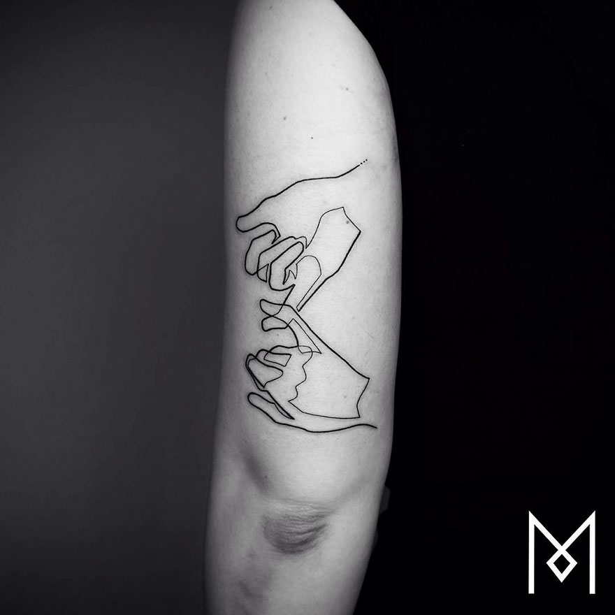 Minimalist single line tattoo depicting hands on a person's upper arm.