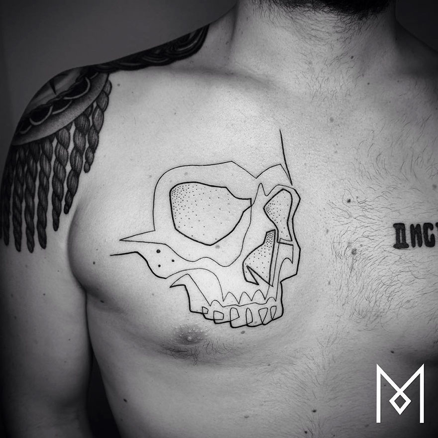 Minimalist single line tattoo of a skull on a man's chest, designed by Iranian-German artist.