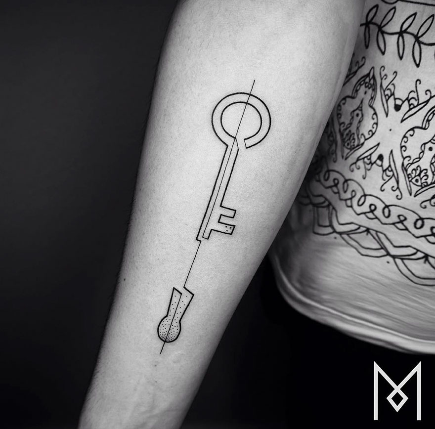 Minimalist single line tattoo of a key on a person's forearm, created by an Iranian-German artist.
