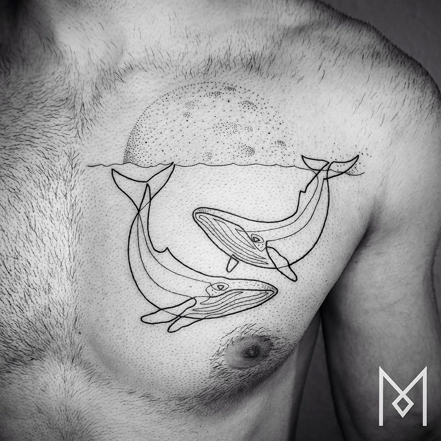 Minimalist single line tattoo of whales on a chest, featuring a moon above the waterline.