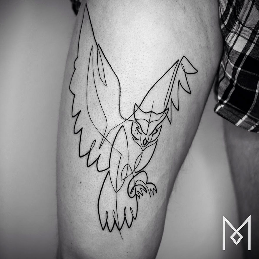 Minimalist single line tattoo of an owl in flight on a person's thigh, showcasing intricate design by an artist.