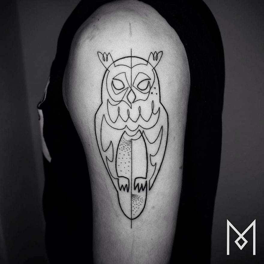 Minimalist single line tattoo of an owl on a person's upper arm, created by an Iranian-German artist.