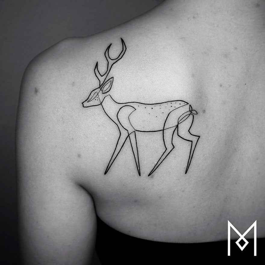 Minimalist single line deer tattoo on person's shoulder by Iranian-German artist.