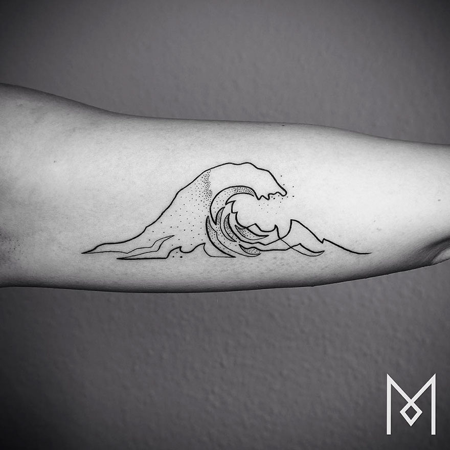 Minimalist single line tattoo of a wave on a person's forearm by an Iranian-German artist.