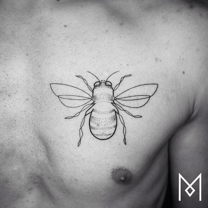 Minimalist single line tattoo of a bee on a person's chest by an Iranian-German artist.