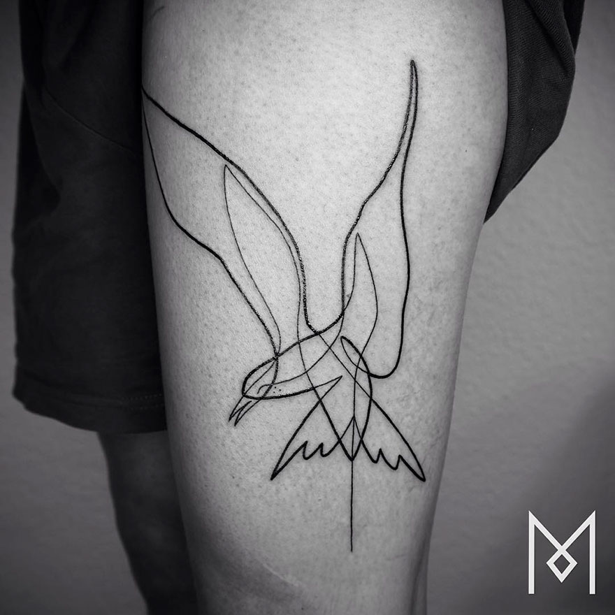 Minimalist single line tattoo of a bird on a person's leg, by Iranian-German artist.