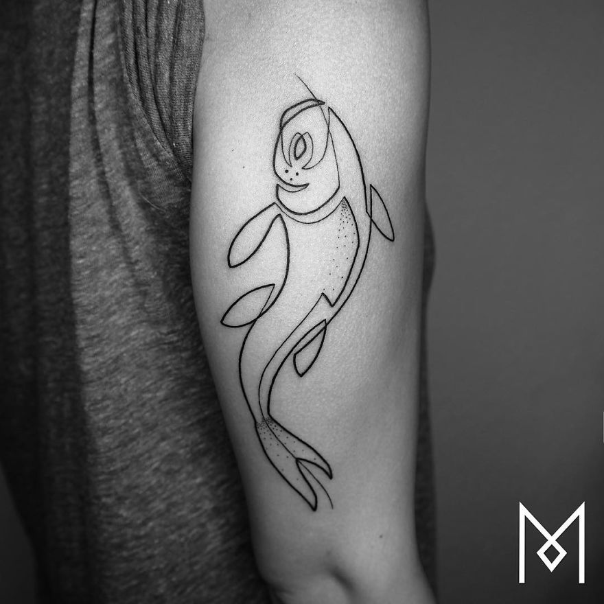 Minimalist single line tattoo of a fish on an arm designed by an Iranian-German artist.