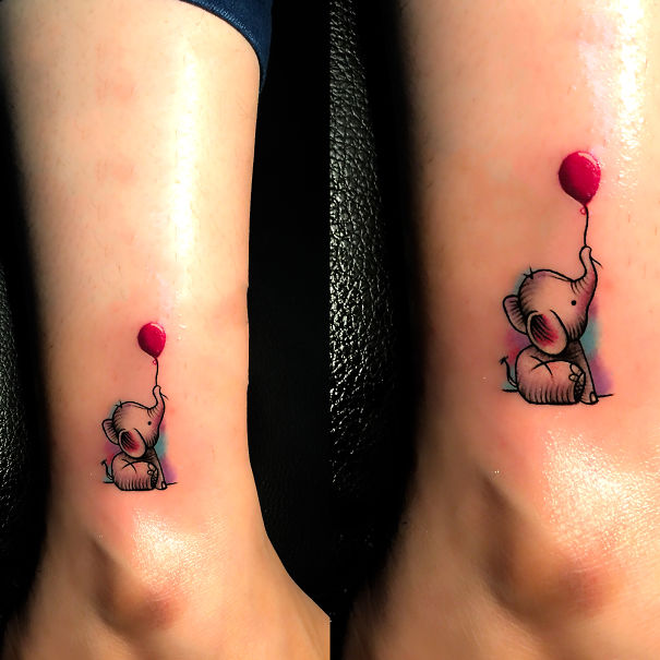 Cute small foot tattoo of an elephant with a red balloon, showing minimalist design.