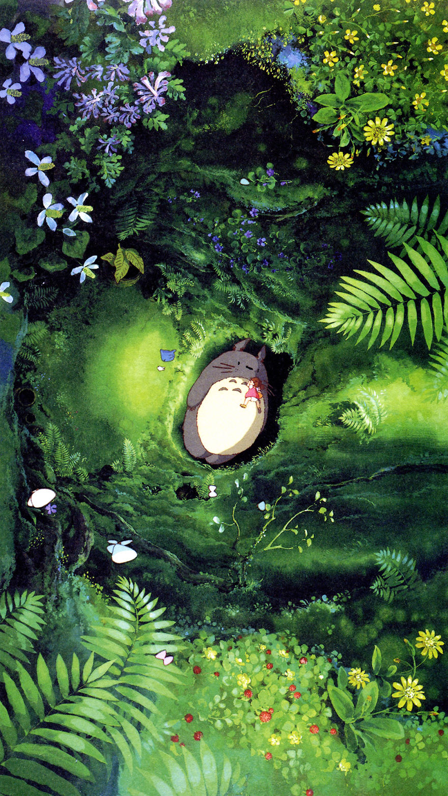 Studio Ghibli wallpaper featuring Totoro resting in a lush green forest surrounded by flowers and foliage.