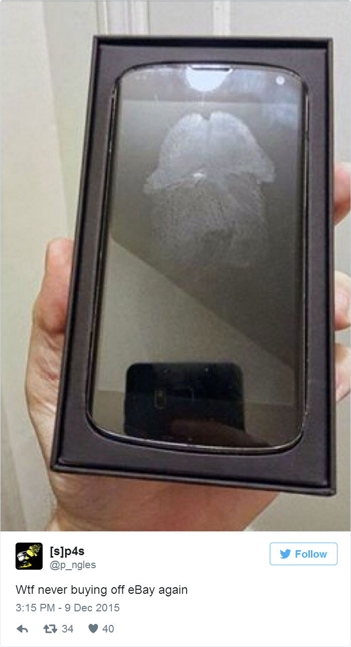 Regrettable online purchase of a scratched phone displayed in its box.