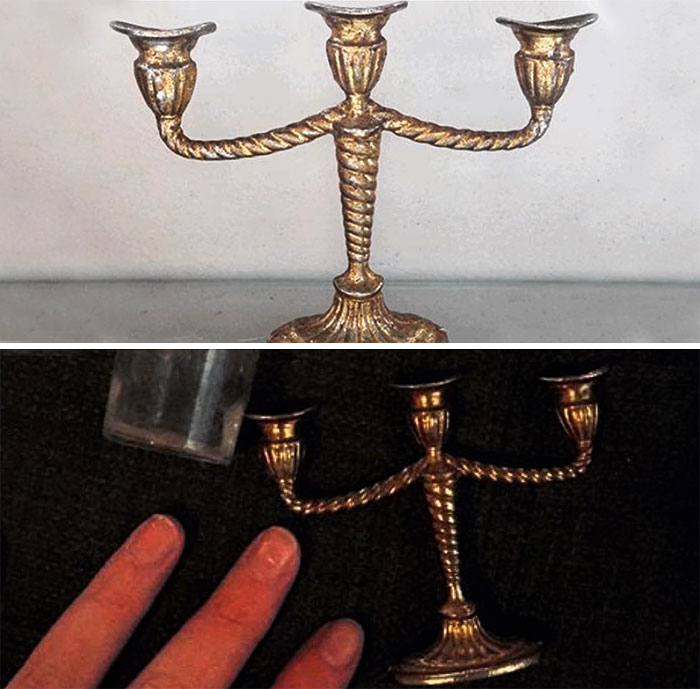 Miniature candelabra next to fingers, illustrating online purchase regret.