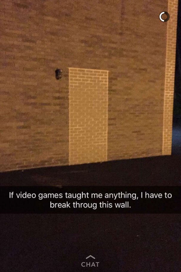 Funny Snapchat of a brick wall with text about video game logic for breaking through walls.