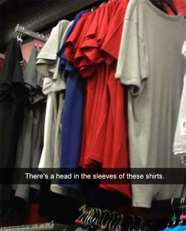 Colorful shirts on hangers with an amusing optical illusion of a human head inside the sleeves, showcasing hilarious Snapchats.