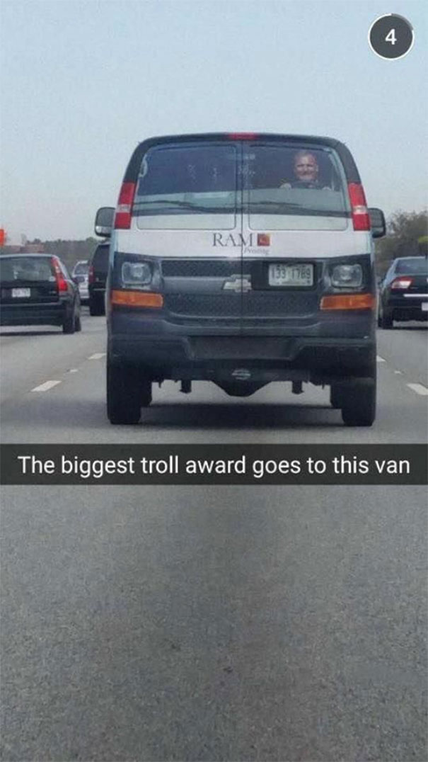 Van with a photo of a driver on the rear window causing a funny prank.