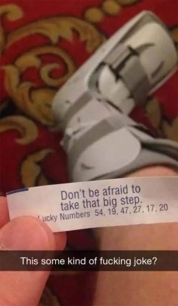 Funny Snapchat with a broken foot cast and a fortune message, "Don't be afraid to take that big step," creating an ironic moment.