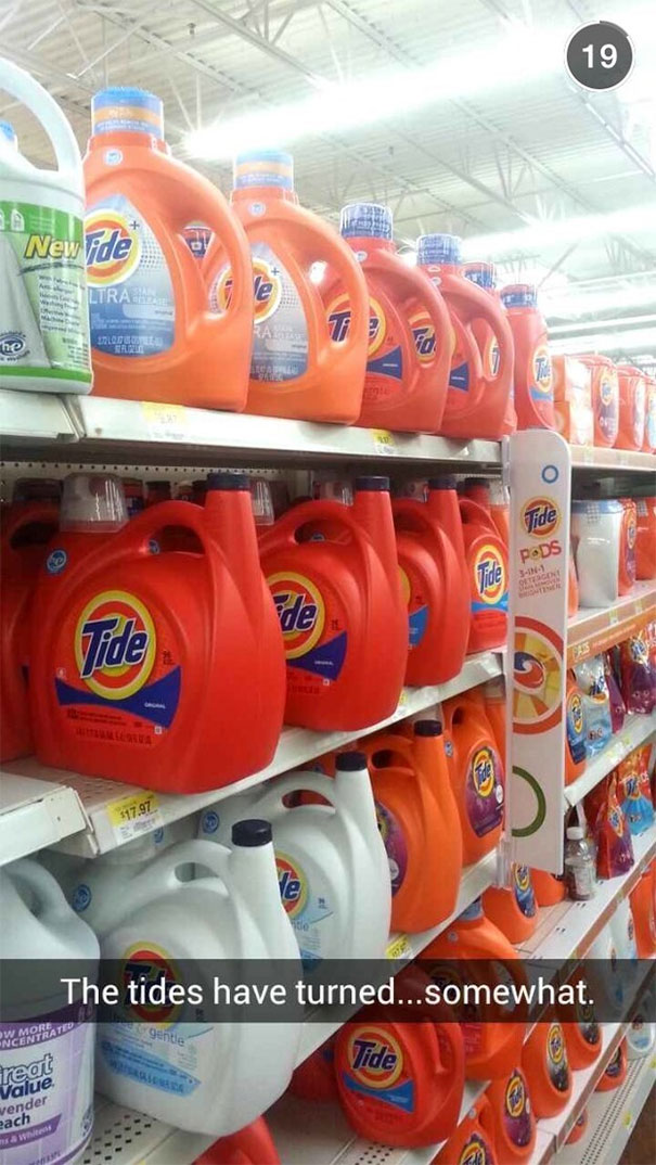 Funny Snapchat of Tide detergent bottles on store shelves, captioned with a humorous pun about turning tides.