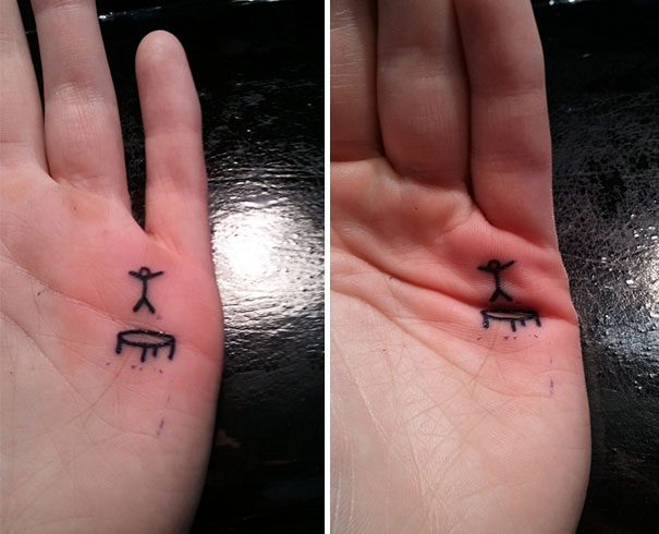 Minimalist tattoo on a palm with clever hidden meaning, depicting a stick figure on a trampoline.