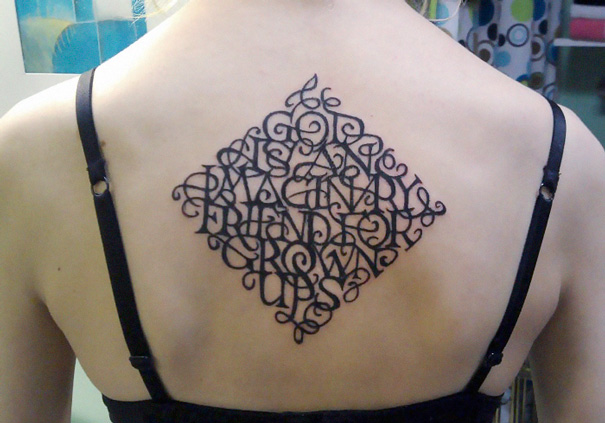 Intricate tattoo on a person's back, featuring a clever design with hidden meaning.