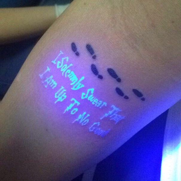 UV tattoo with hidden meaning: "I Solemnly Swear That I Am Up To No Good" illuminated under blacklight.