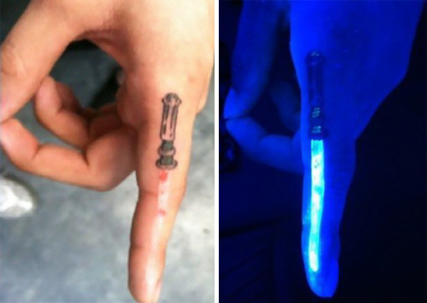 Finger tattoo with a hidden lightsaber theme, glowing under UV light.