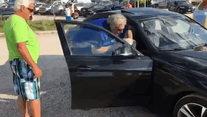 man-break-window-stone-dog-hot-car-2 man-break-window-stone-dog-hot-car-2