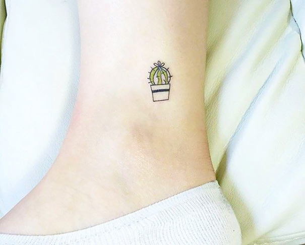 Small foot tattoo of a green cactus in a pot, showcasing minimalist design ideas.