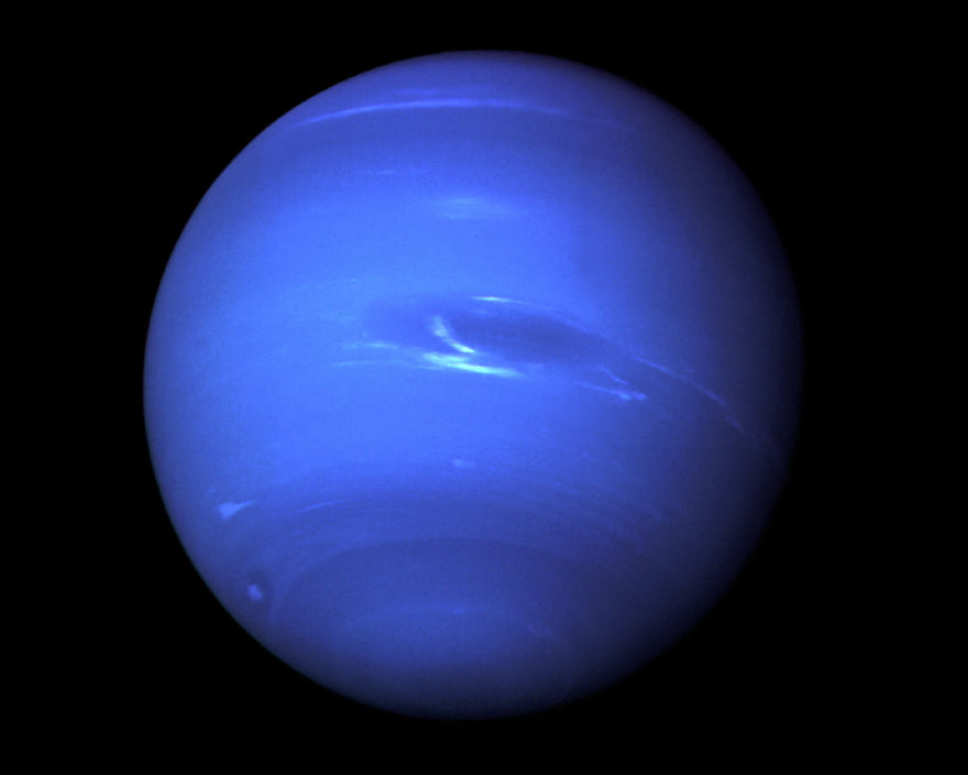Blue planet Neptune with dark and light blue swirling patterns, set against a black background.