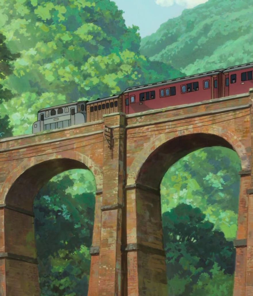 Train on a bridge surrounded by lush greenery in a Studio Ghibli style illustration.