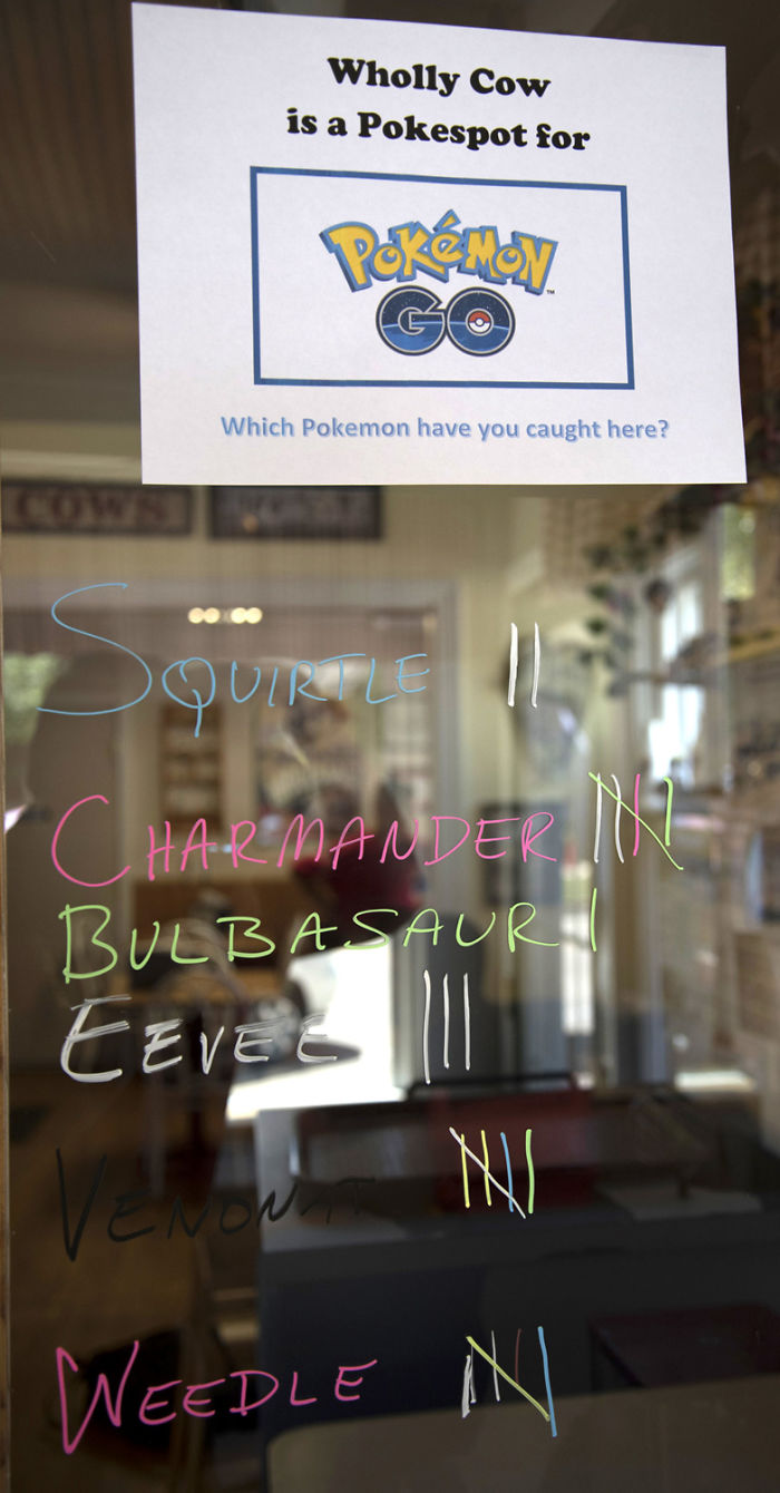 Sign at a Pokespot for Pokemon Go showing a tally of caught Pokemon such as Squirtle and Charmander.
