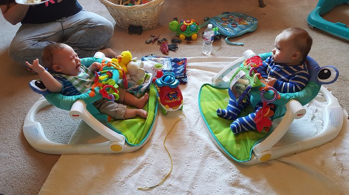 Plays Happily In His Chair Until You Pull Out Your Camera