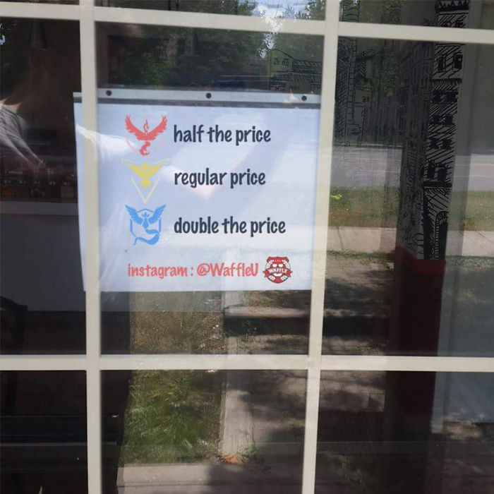 Sign in a window using Pokemon Go team logos to offer discounts and surcharges.