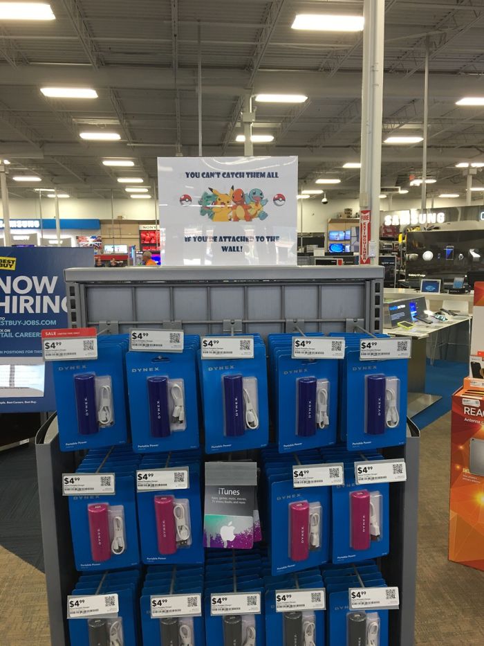 Store display with Pokemon-themed sign promoting portable chargers, leveraging the Pokemon Go craze.